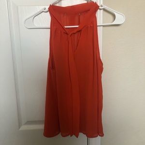 Translucent orange blouse